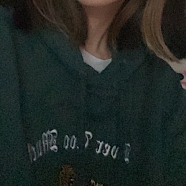 2021 wearing a green hoodie